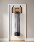 Hoop Laundry Hamper hanging on a white door, oak-effect backboard, black rim and long black mesh bag