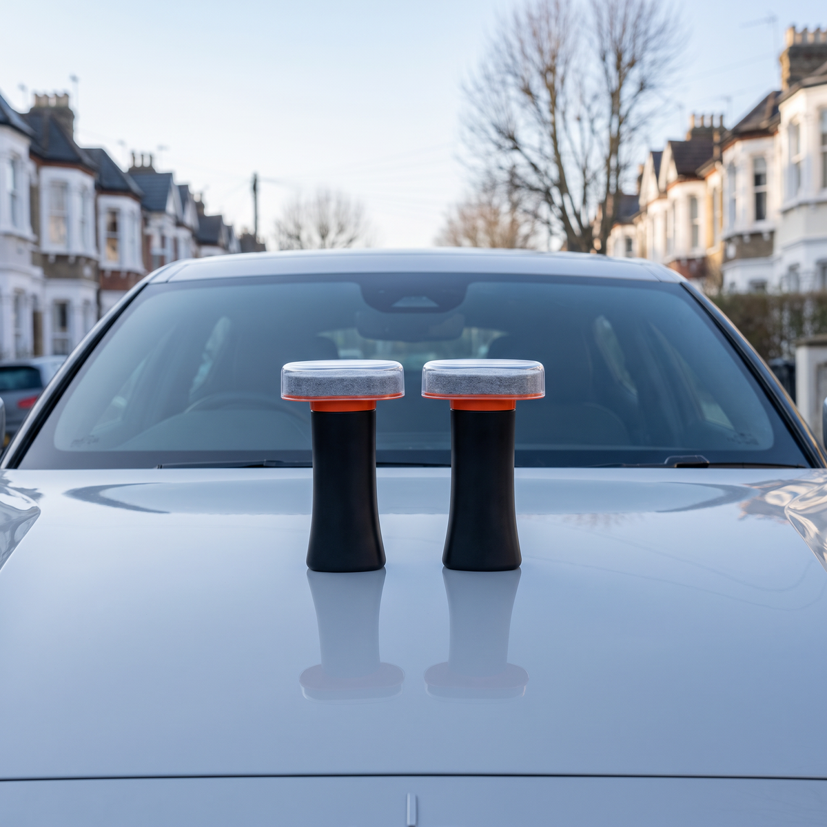 Windscreen Oil Film Remover on a car bonnet in front of a clean windscreen